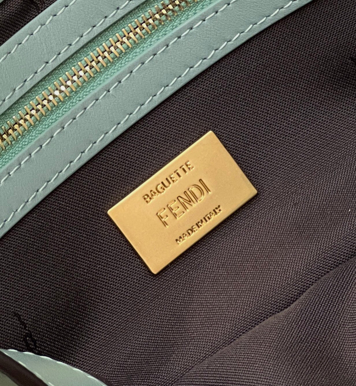 BAGUETTE WITH FF MOTIF 27 IN VIRIDIAN GREEN SOFT LAMBSKIN GOLD HARDWARE